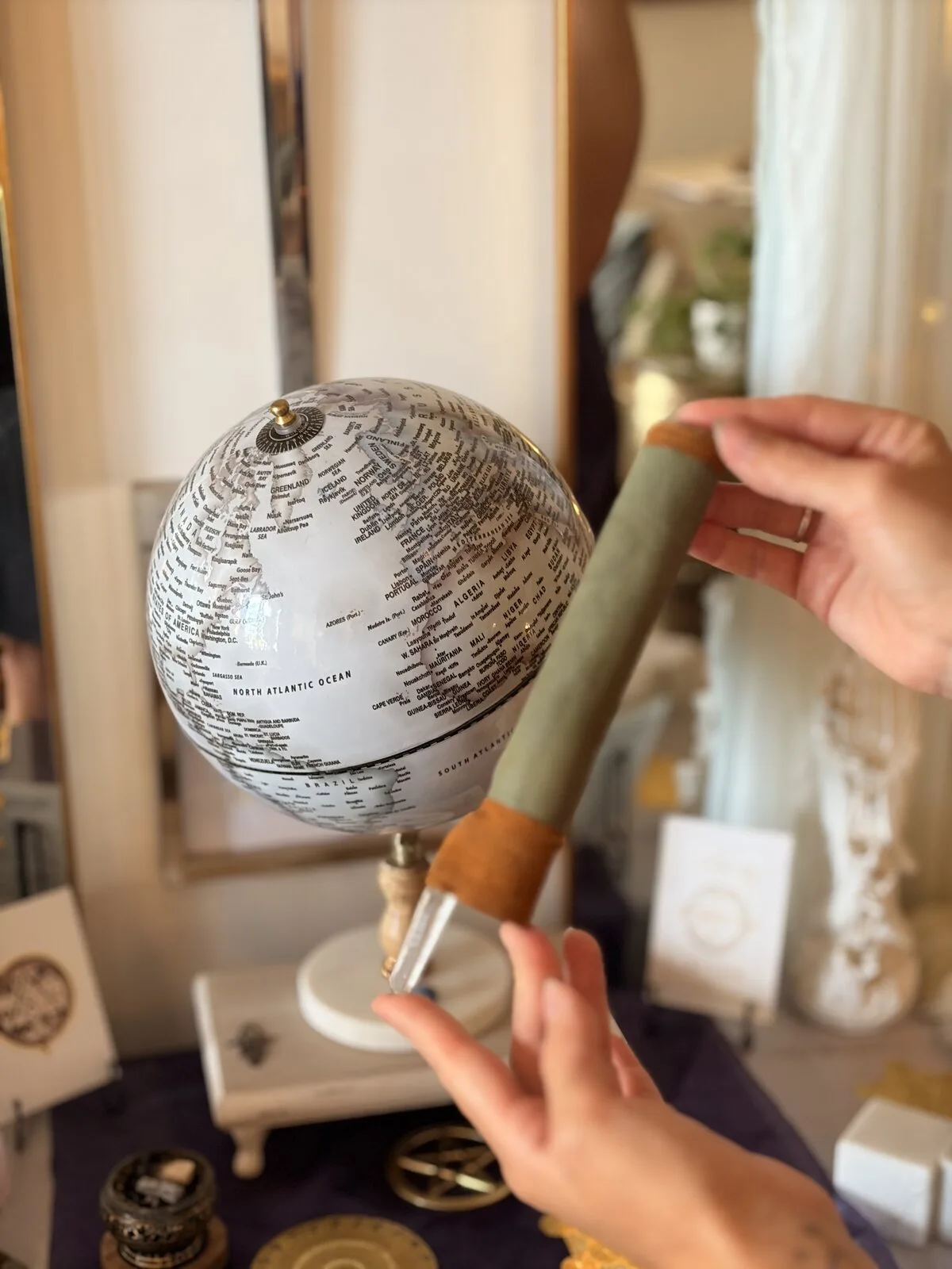 Hands working with a globe during an energy practice